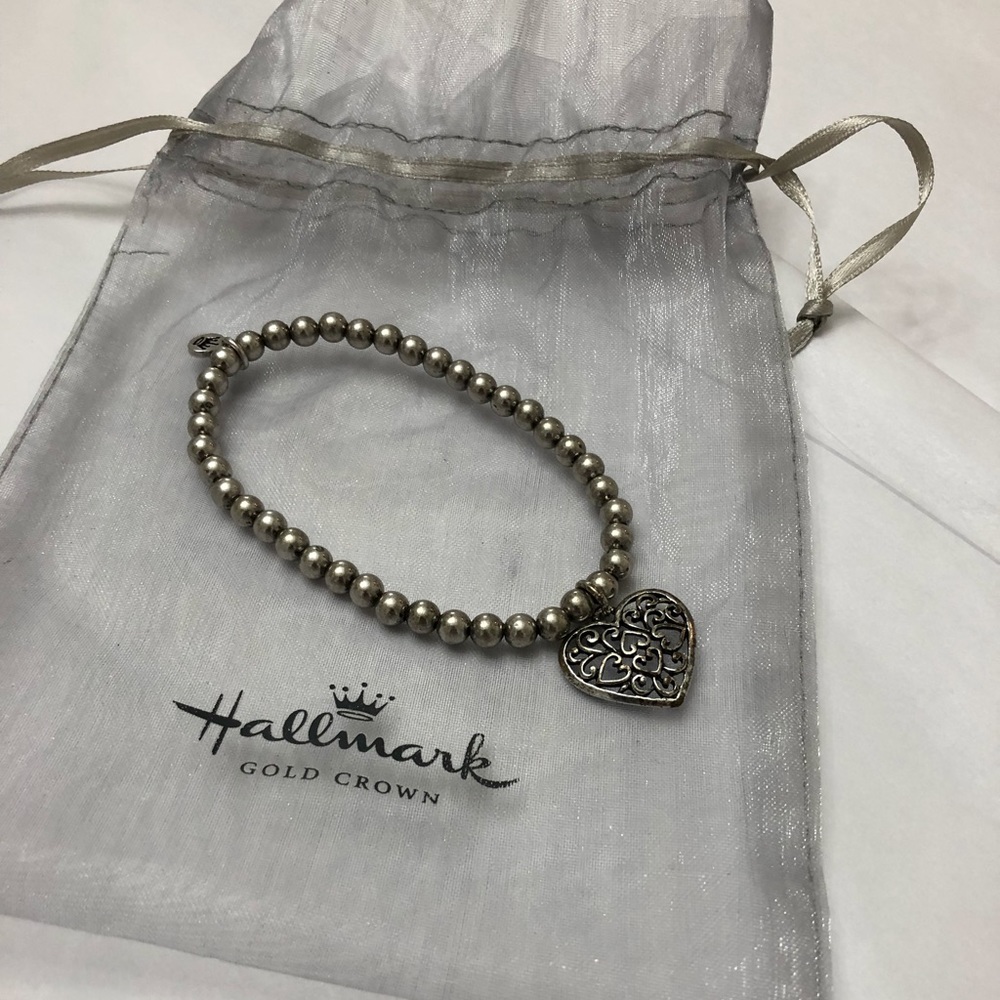 Cute Silver toned beaded bracelet with heart charm